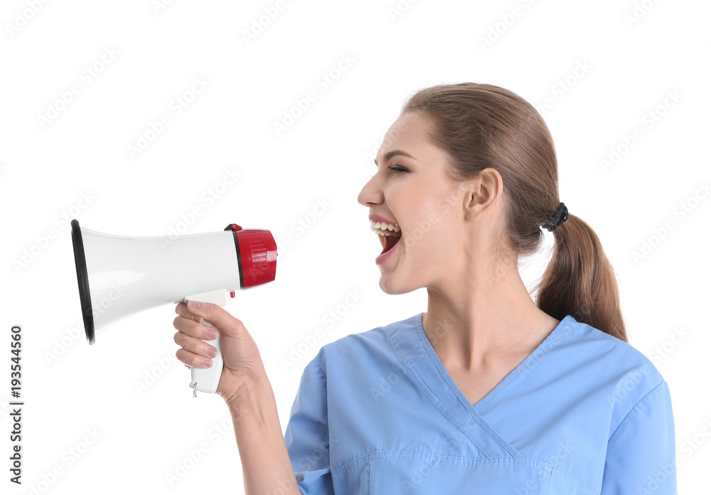 Young female doctor with megaphone on white background Young female doctor with megaphone on white background