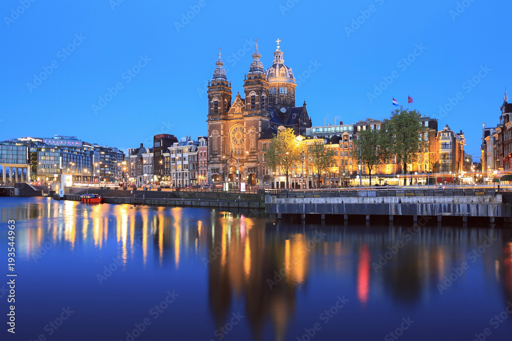 Selective focus on St Nicolas Church in Amsterdam at twilight, Netherlands