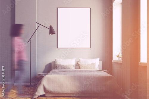 Gray bedroom interior with a poster toned