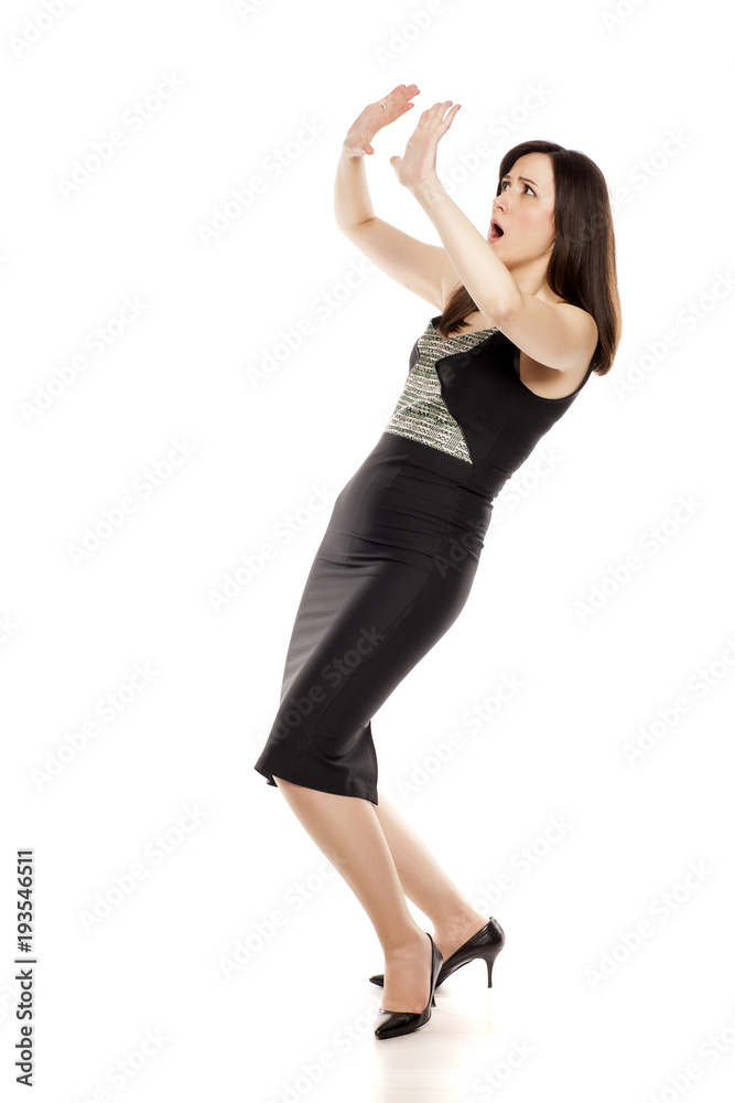 Afraid businesswoman with defending gesture on white background Afraid businesswoman with defending gesture on white background