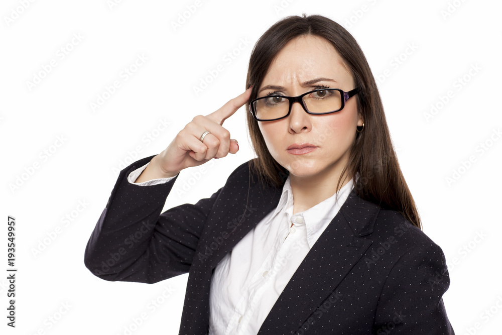 Angry businesswoman with questioning gesture posing on white background Angry businesswoman with questioning gesture posing on white background