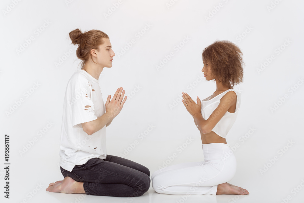 Young couple in yoga pose Young couple in yoga pose