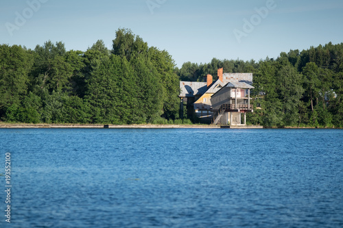 Modern Building near by Water Lake in Trakai Lithuania with Boat and People