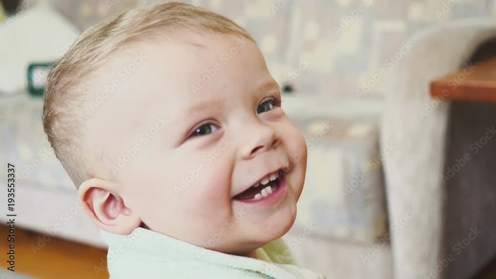 portrait of a smiling boy in a room portrait of a smiling boy in a room