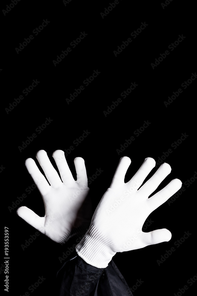 cropped image of mime showing block sign isolated on black cropped image of mime showing block sign isolated on black
