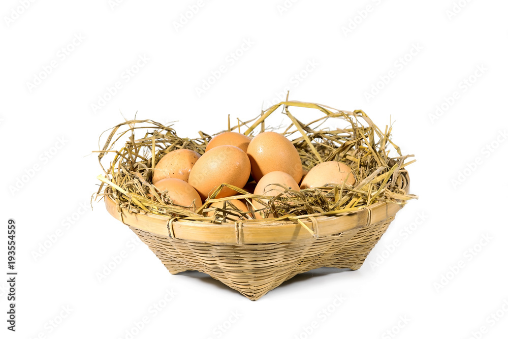Group of eggs with straw in a bamboo basket isolated on white background. Group of eggs with straw in a bamboo basket isolated on white background.