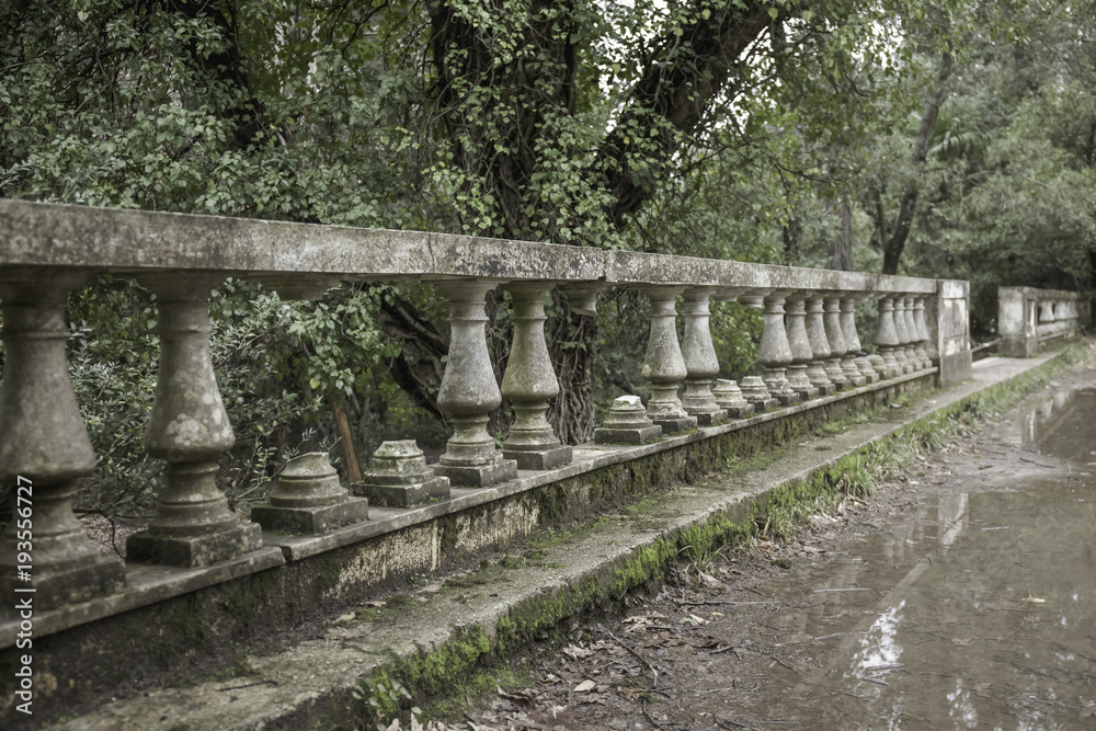 old abandoned park with ruined neoclassical constructions