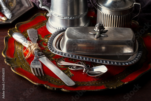 Φωτογραφία Old silver dishes with accessories for the kitchen