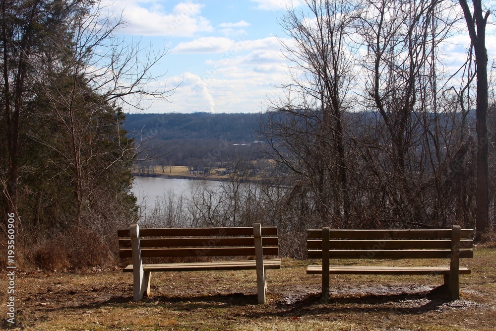 The benches overlooking the river on a sunny day. The benches overlooking the river on a sunny day.