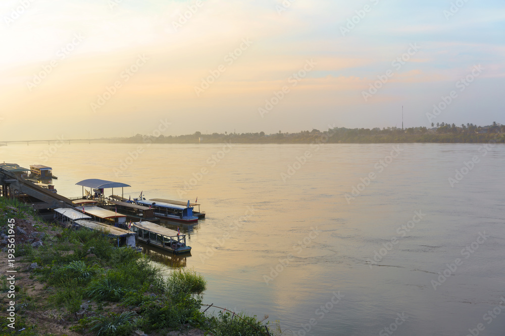 Mekong river in the evening in winter viewing Thai–Lao Friendship Bridge in distance , Nong Khai ,Thailand