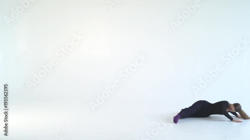 young graceful woman dancing modern dance on white background. contrast video black and white colors. Contemporary 4k