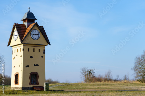 Clock Tower in one of the oldest villages in Germany - Gielsdorf (Altlandsberg). The first mention in the chronicles of 1375. Federal state of Brandundburg. photo