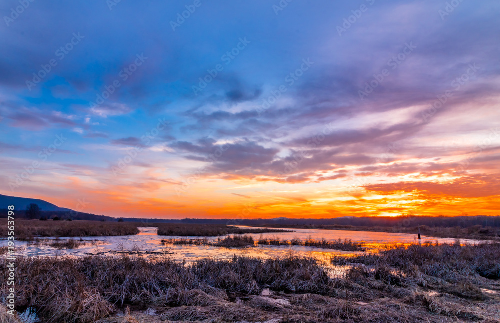 Sunset at Liberty Loop, part of the Wallkill River NWR, NJ, in late winter as the ice melts off the marshlands
