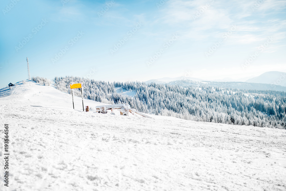 Landscape view on the snowy mountains with ski slopes in the Carpathians Landscape view on the snowy mountains with ski slopes in the Carpathians