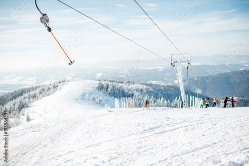 Landscape view on the snowy mountains with ski slopes in the Carpathians
