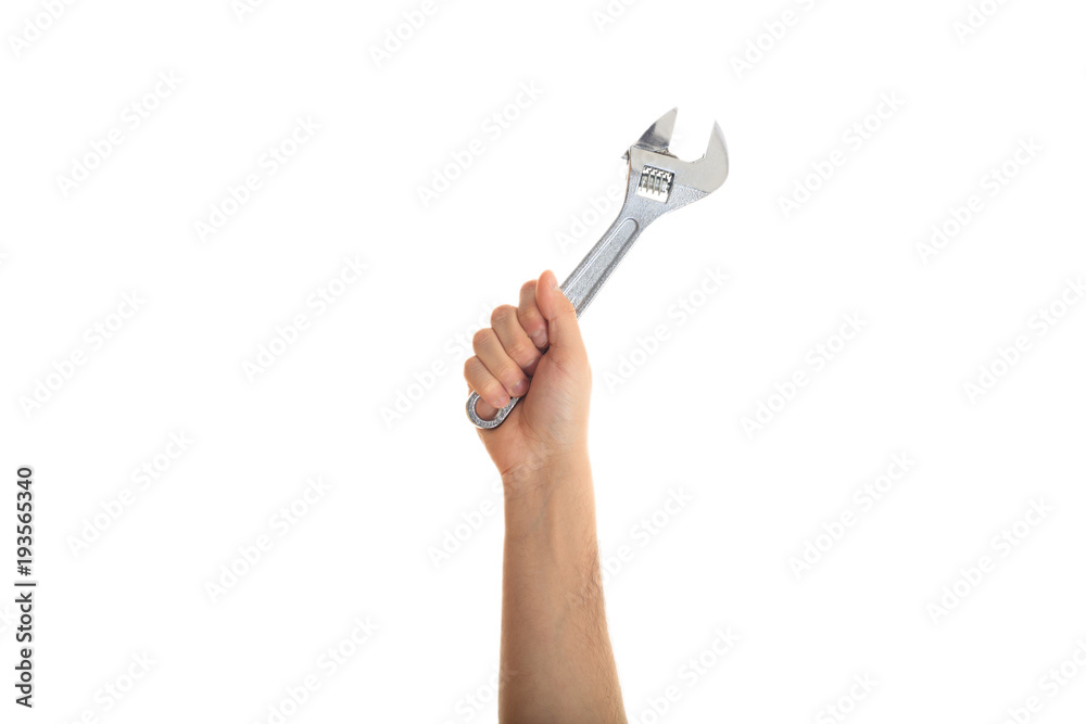 Hand holding a metal wrench on white background Hand holding a metal wrench on white background