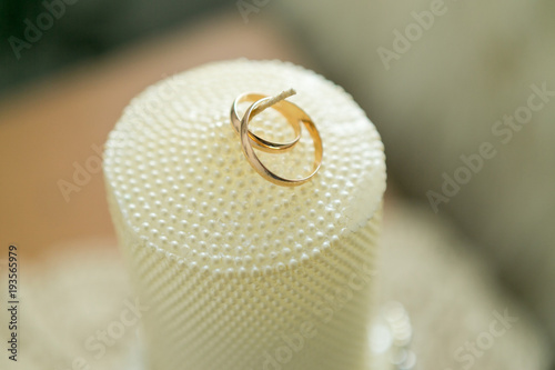 Wedding candle with rings and pearls, Two wedding rings on a candle