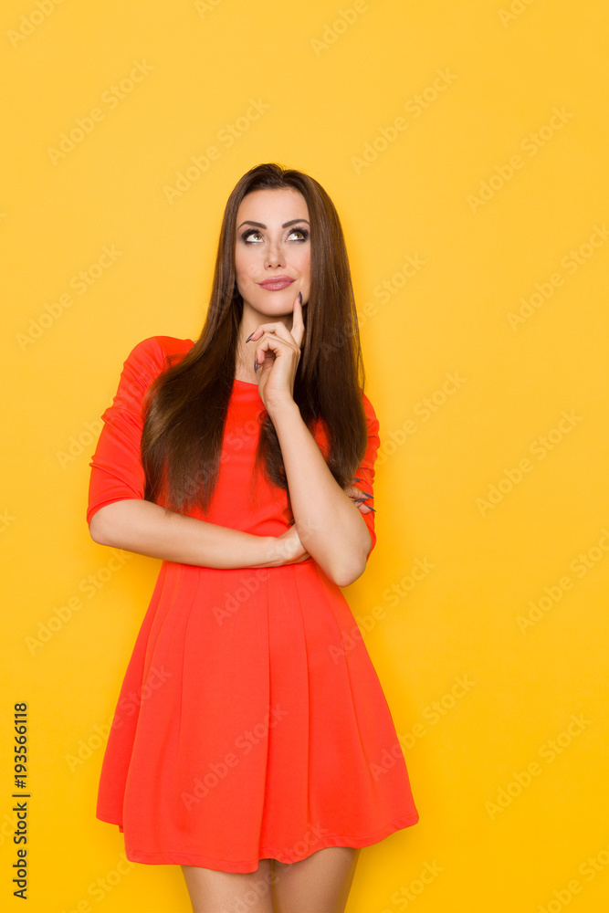 Skeptic Woman In Red Mini Dress Is Looking Up Skeptic Woman In Red Mini Dress Is Looking Up