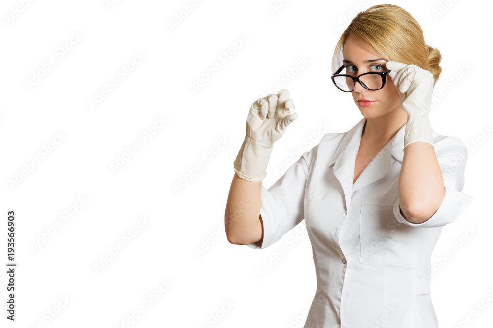 Woman doctor holding a pill treatment isolated on white background