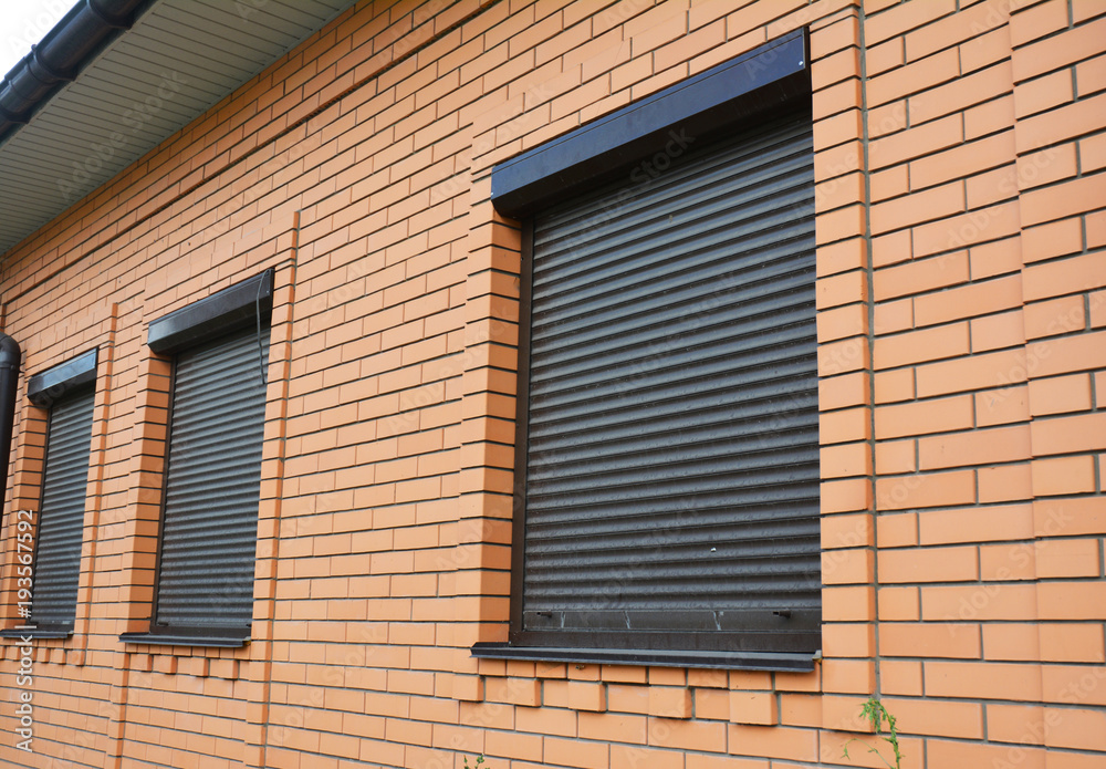 House Windows with rolling shutters for home protection.