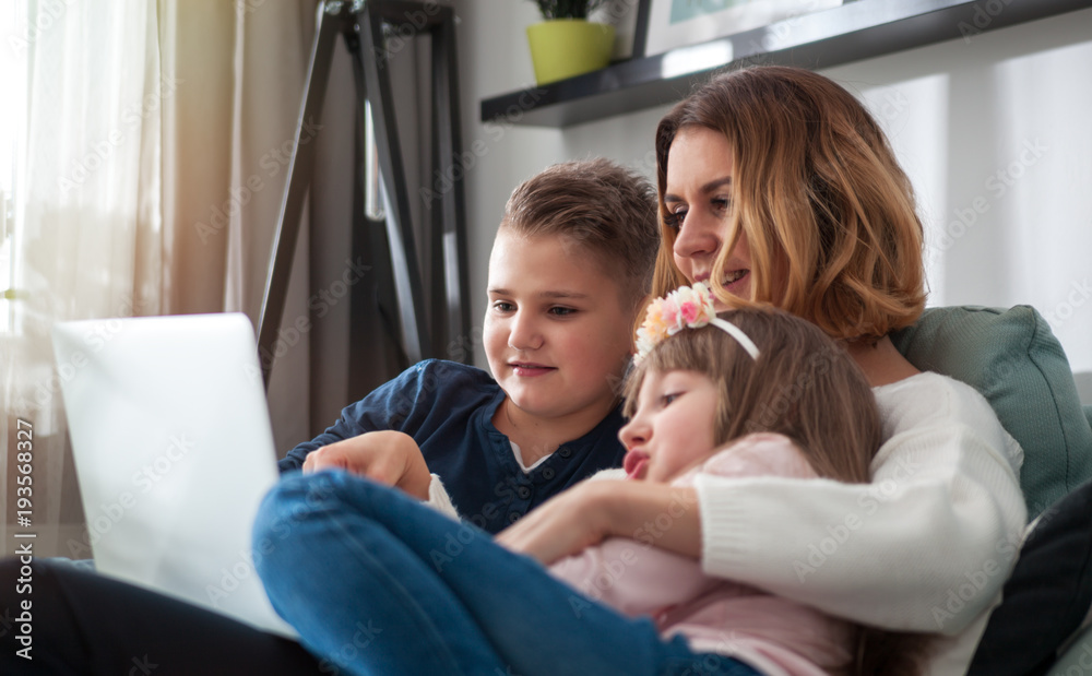 Happy family using together pc laptop at home Happy family using together pc laptop at home