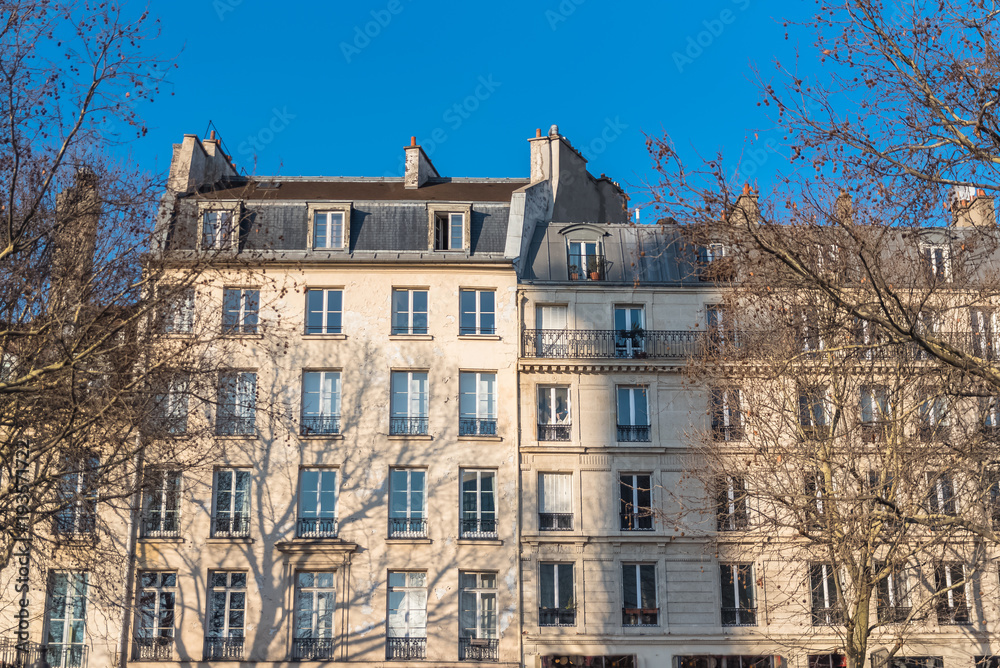 Paris, typical facade in a charming district, place de la Bastille, beautiful building 
