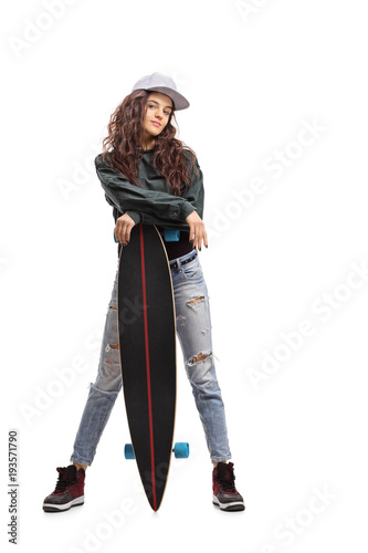 Skater girl posing with a longboard