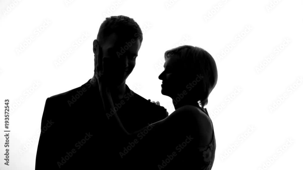 Loving woman kissing boyfriend on cheek, happy couple relations, romantic date Loving woman kissing boyfriend on cheek, happy couple relations, romantic date