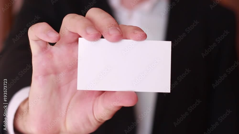 Blank business card showed by businessman Blank business card showed by businessman