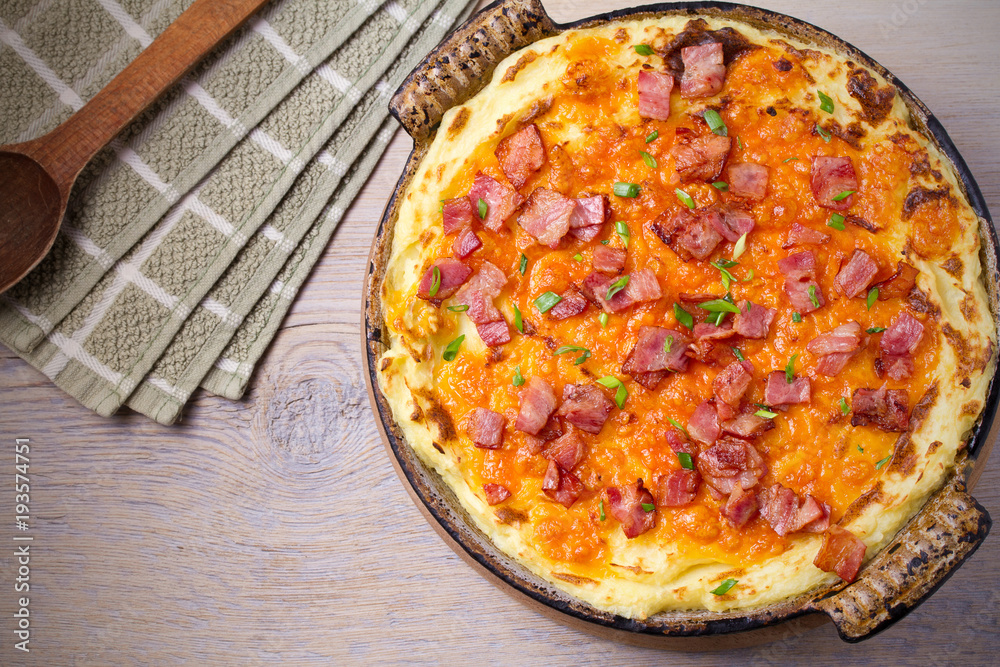 Cheddar Mashed Potato with Bacon Cooked in Oven. Baked Cheddar Potato Casserole