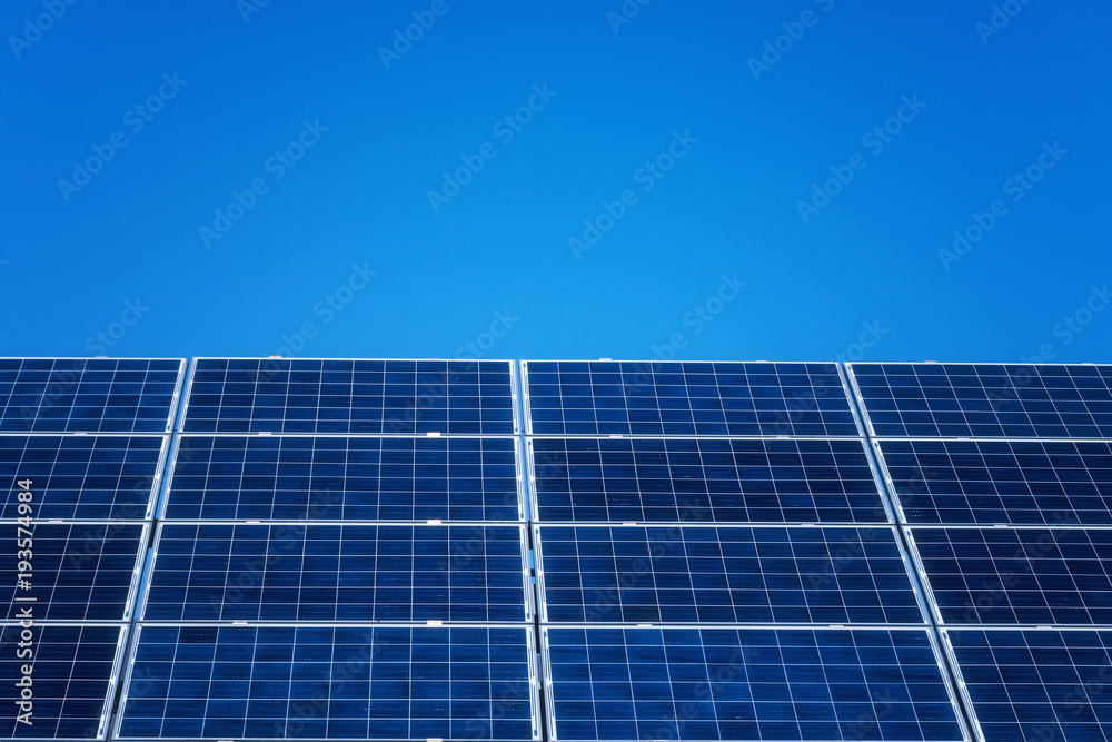 Solar power plant panels with blue sky, ecological energy background Solar power plant panels with blue sky, ecological energy background