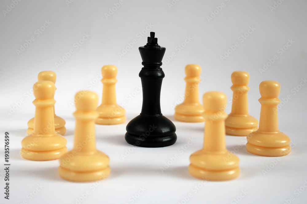 Chess figure, business concept strategy, leadership, team and success. Leadership concept, black king of chess among white pawns. leadership, confidence and imagination concept. Chess figure, business concept strategy, leadership, team and success. Leadership concept, black king of chess among white pawns. leadership, confidence and imagination concept.