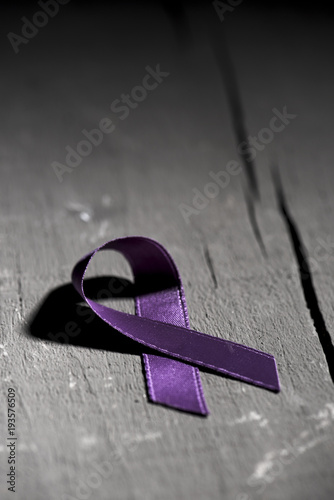 purple ribbon against the violence against women