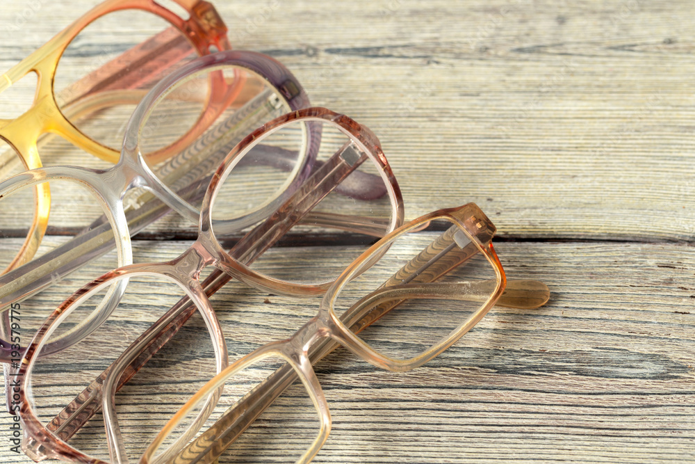 eyeglasses on wooden table eyeglasses on wooden table