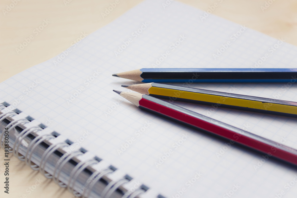 Open blank notebook on wood background with pencil. Open blank notebook on wood background with pencil.