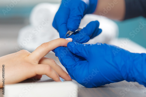 Woman hands receiving a manicure in beauty salon