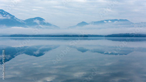 Morning scene on misty mountain lake