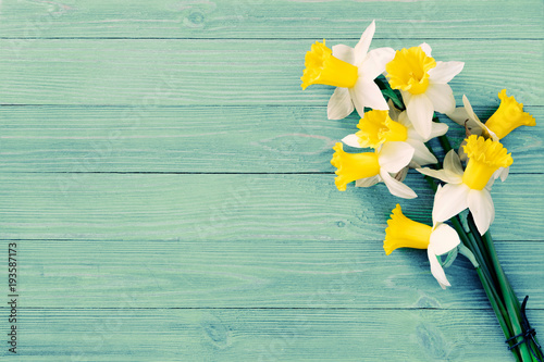 Fototapeta Naklejka Na Ścianę i Meble -  Daffodils flowers on wooden background 