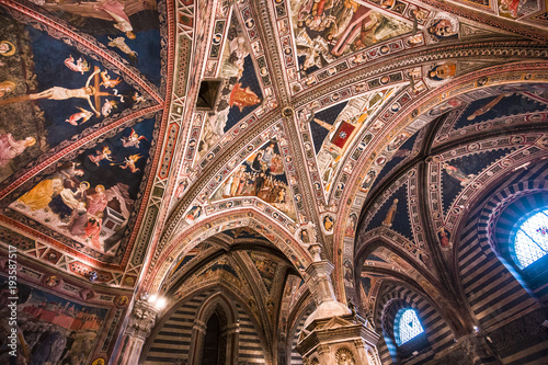 interiors and decors of the baptistery, Siena, Italy photo