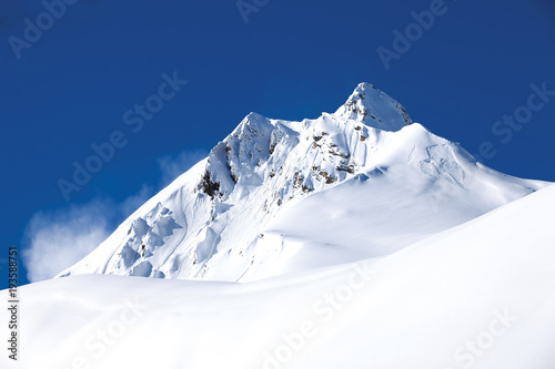 Fototapeta Winter mountain with white snow peak in France