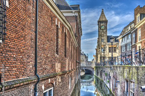 Narrow section of the Nieuwe Gracht (New Canal), with brick walls on both sides, in the old center of Utrecht, the Netherlands