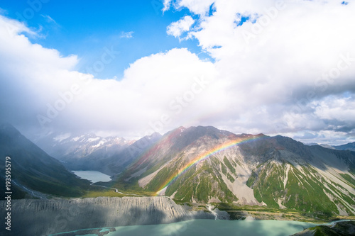 Stunning view on the high mountain after the rain with colorful rainbow over the rocky mountain and glacier in Mt Cook National park
