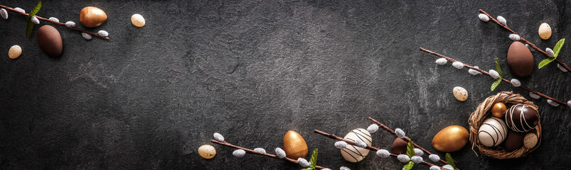 Easter Decoration With Golden Eggs on Dark Shale Background