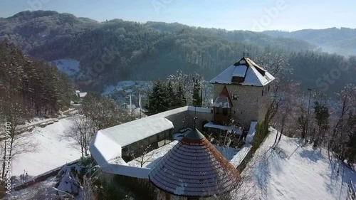Aerial: Going towards snowy city castle.