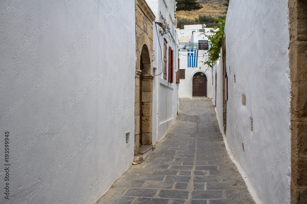 Narrow street in Lindos, Rhodes Island, Greece