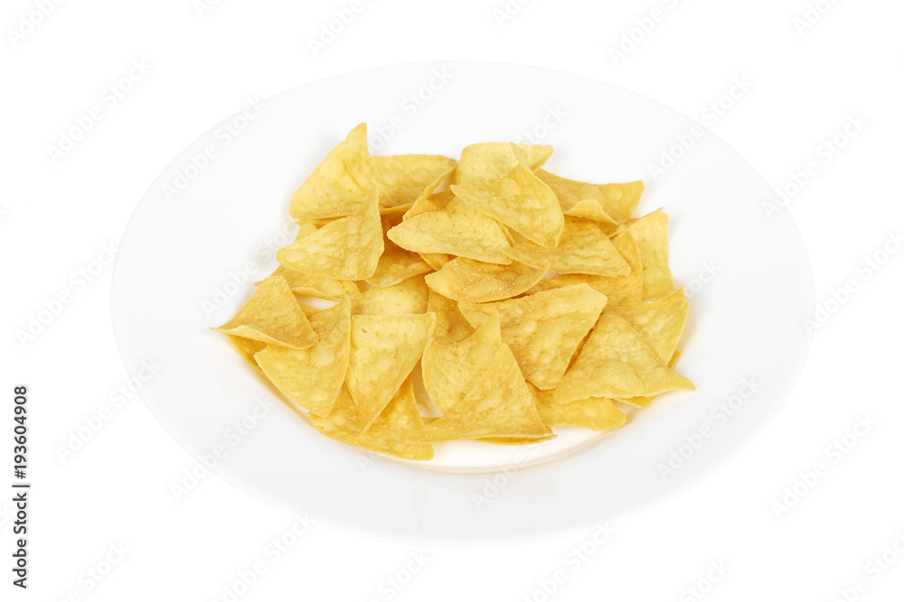 Corn chips, triangle nachos on plate. Isolated on white background. Fast food snack, mexiacan tortilla Corn chips, triangle nachos on plate. Isolated on white background. Fast food snack, mexiacan tortilla