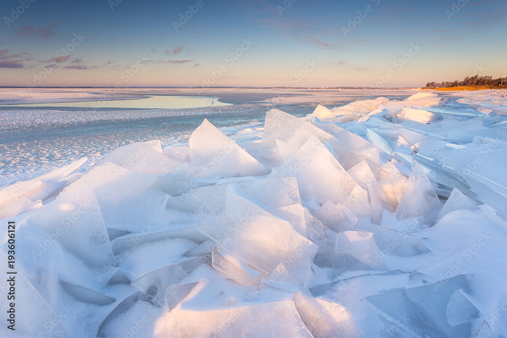 Ice floe on the beach in the village of Chalupy in the Poland.
