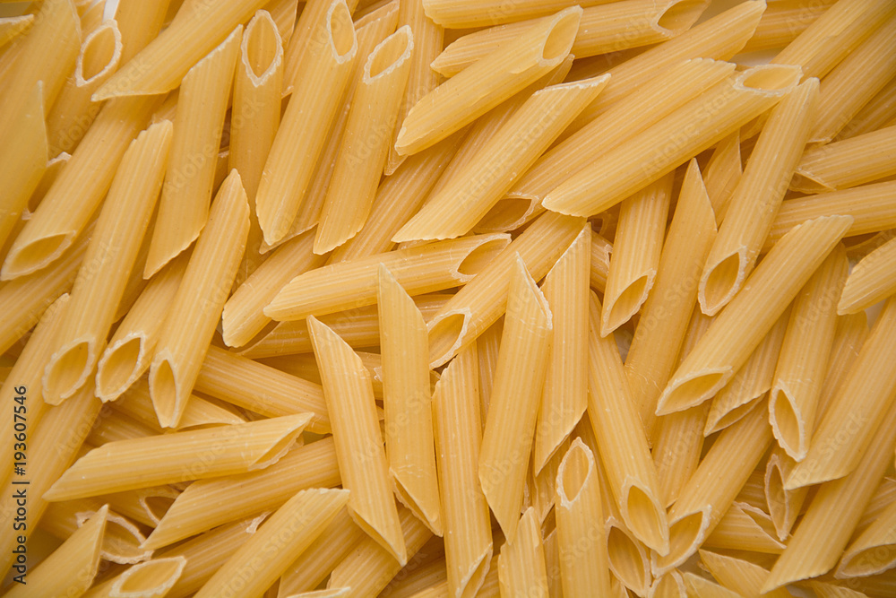 Fusilli Pasta texture background. Pasta is a staple food of traditional Italian cuisine. Fusilli Pasta texture background. Pasta is a staple food of traditional Italian cuisine.