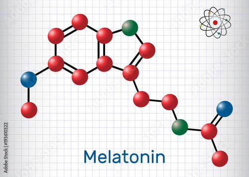 Melatonin molecule, sleep hormone. Atoms are represented as spheres with color: carbon (red), oxygen (blue), nitrogen (green). Molecular model. Sheet of paper in a cage.