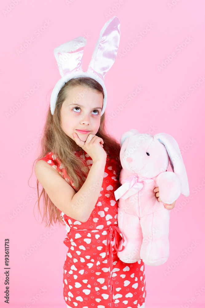 Child with thinking face and bunny ears headband